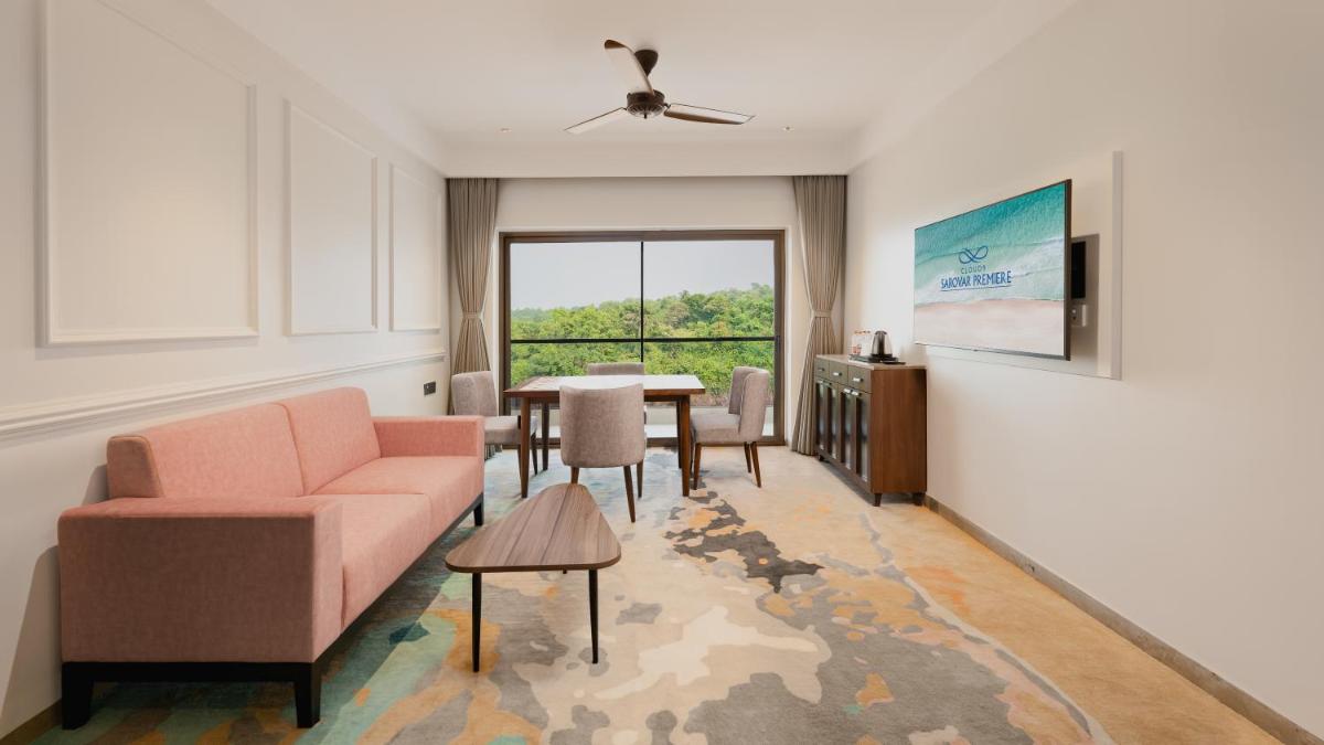 a living room with a couch and a table at Gateway Goa, Palolem in Palolem