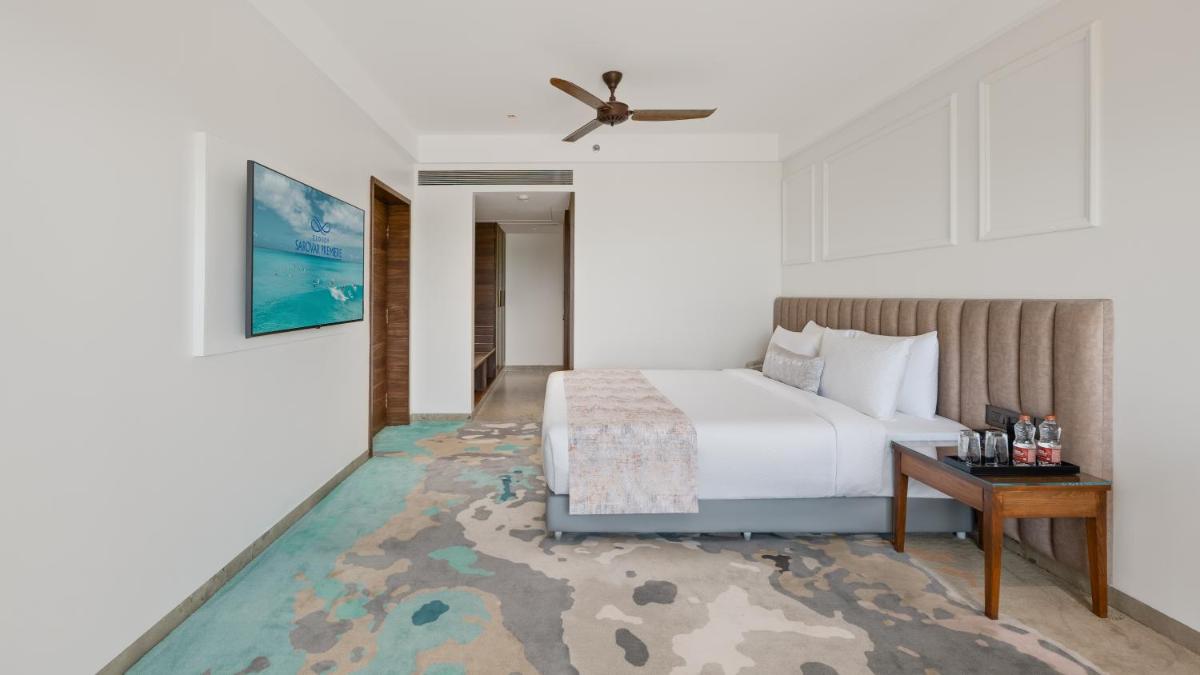 a hotel room with a bed and a table at Gateway Goa, Palolem in Palolem