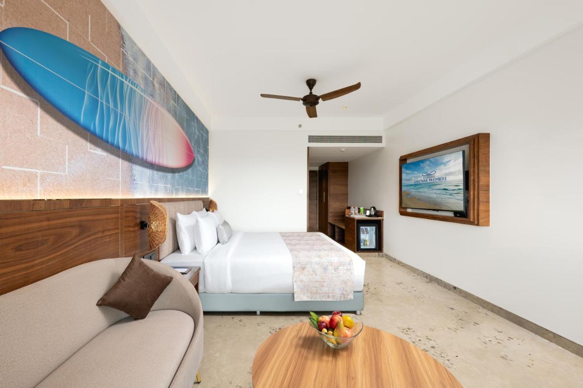a hotel room with a bed and a table at Gateway Goa, Palolem in Palolem