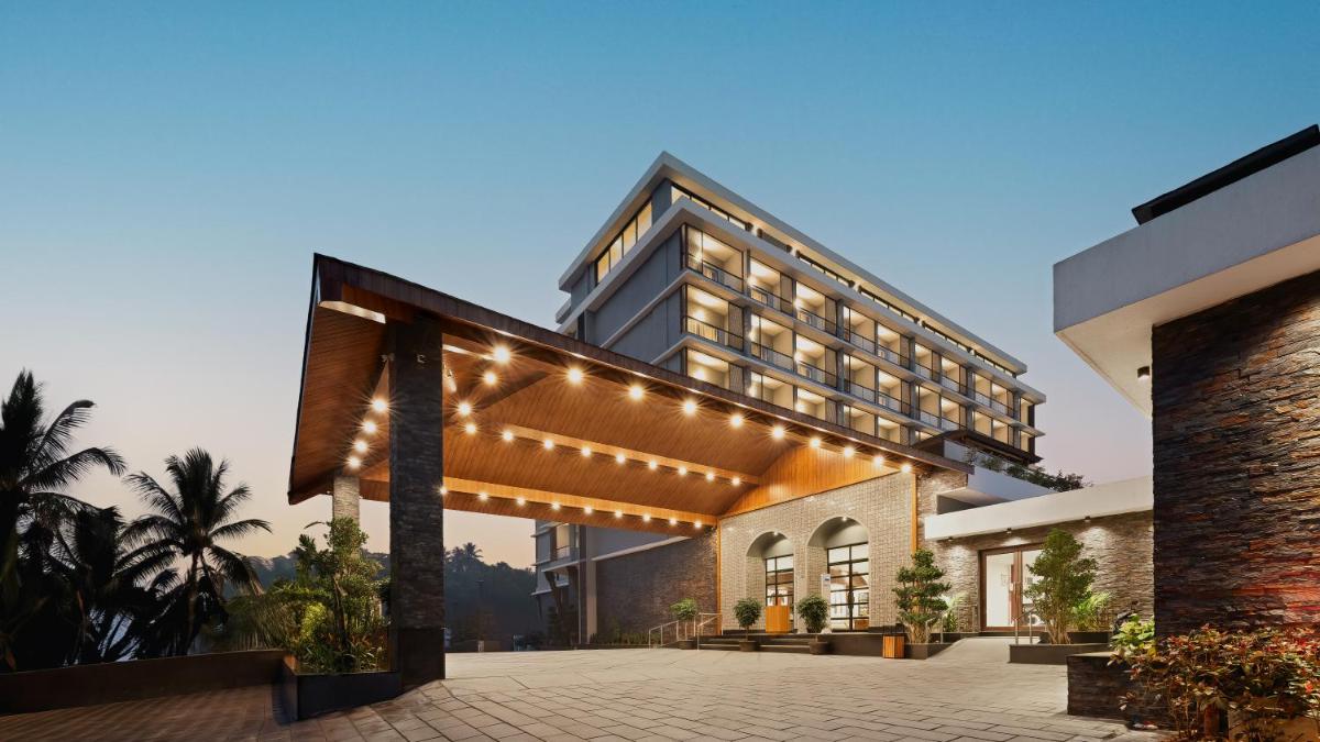 an exterior view of a hotel with lights at Gateway Goa, Palolem in Palolem