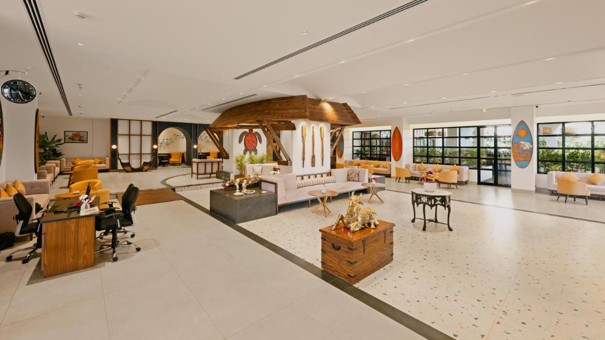 a large lobby with couches and tables and chairs at Gateway Goa, Palolem in Palolem