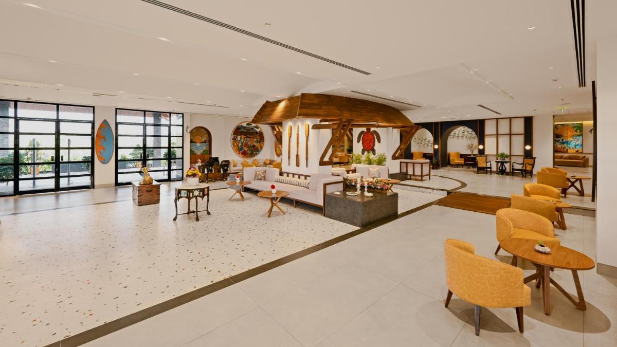 a lobby of a hotel with chairs and tables at Gateway Goa, Palolem in Palolem
