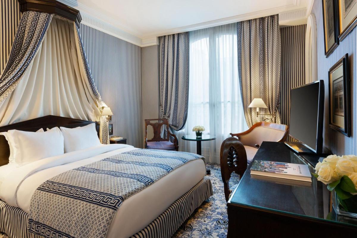 Un ou plusieurs lits dans un hébergement de l'établissement Le Dokhan's Paris Arc de Triomphe, a Tribute Portfolio Hotel