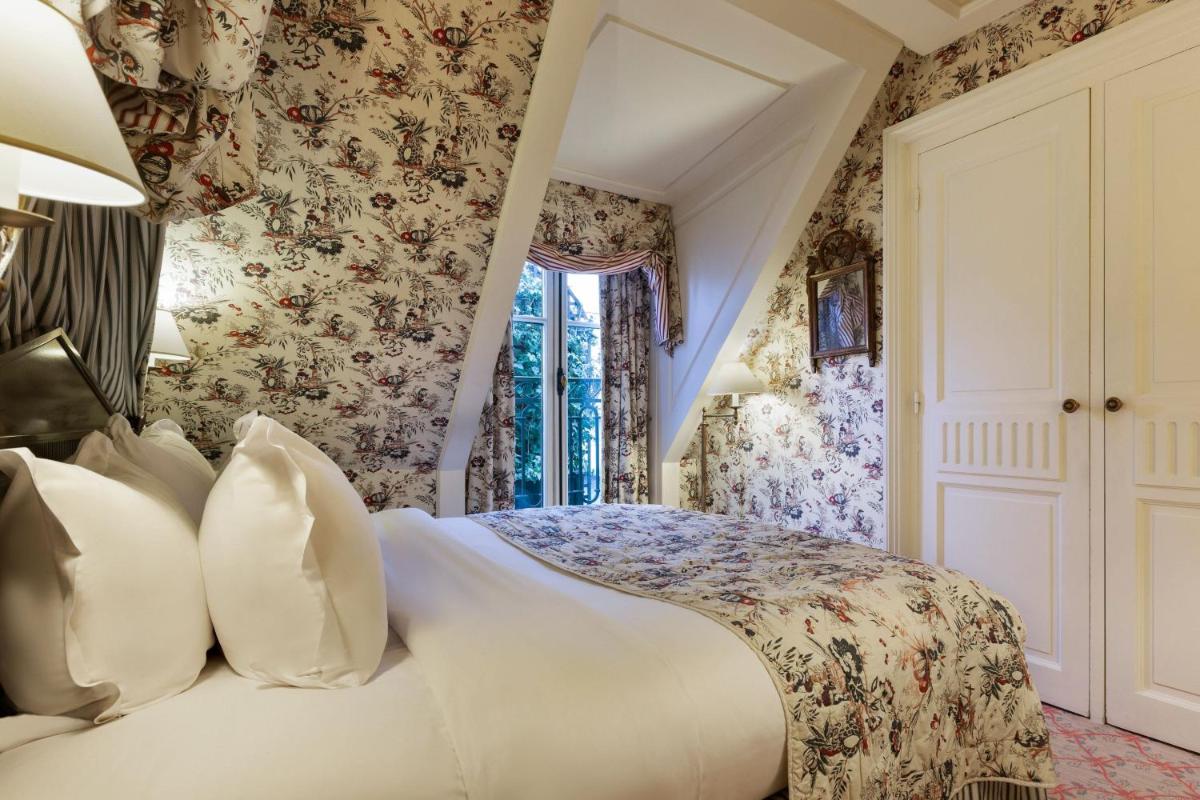 Un ou plusieurs lits dans un hébergement de l'établissement Le Dokhan's Paris Arc de Triomphe, a Tribute Portfolio Hotel