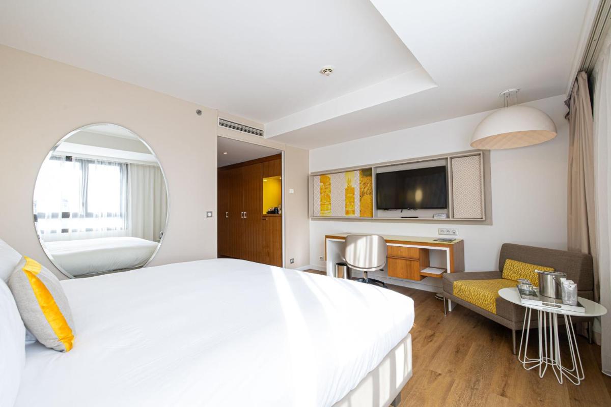 Un ou plusieurs lits dans un hébergement de l'établissement Renaissance Aix-en-Provence Hotel