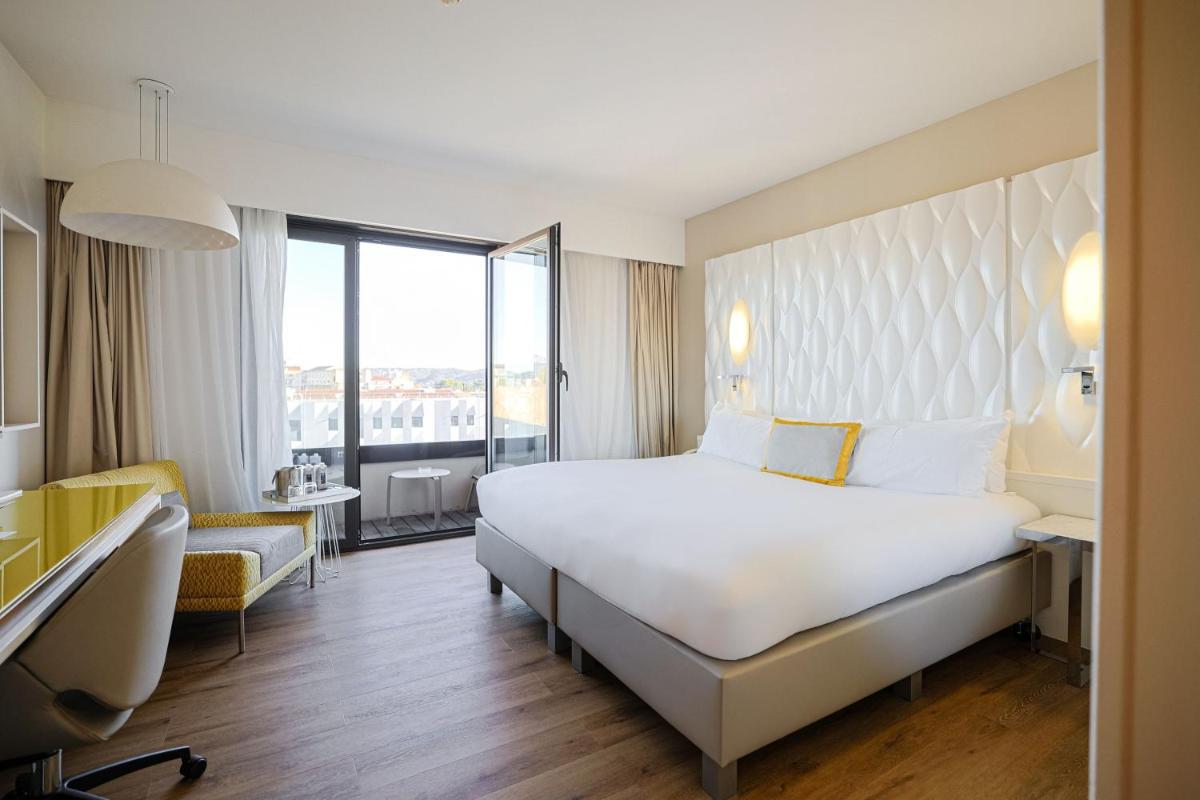 Un ou plusieurs lits dans un hébergement de l'établissement Renaissance Aix-en-Provence Hotel