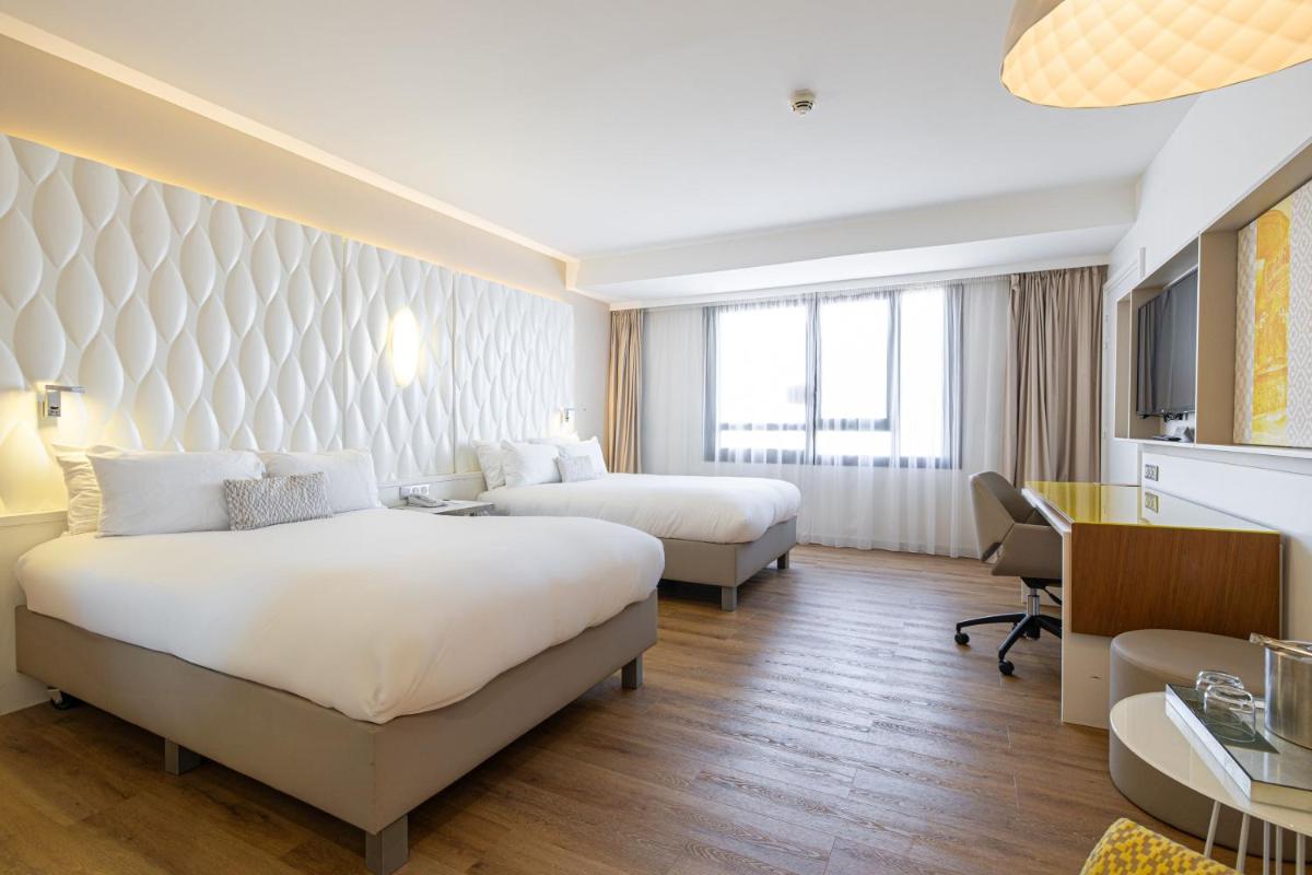 Un ou plusieurs lits dans un hébergement de l'établissement Renaissance Aix-en-Provence Hotel
