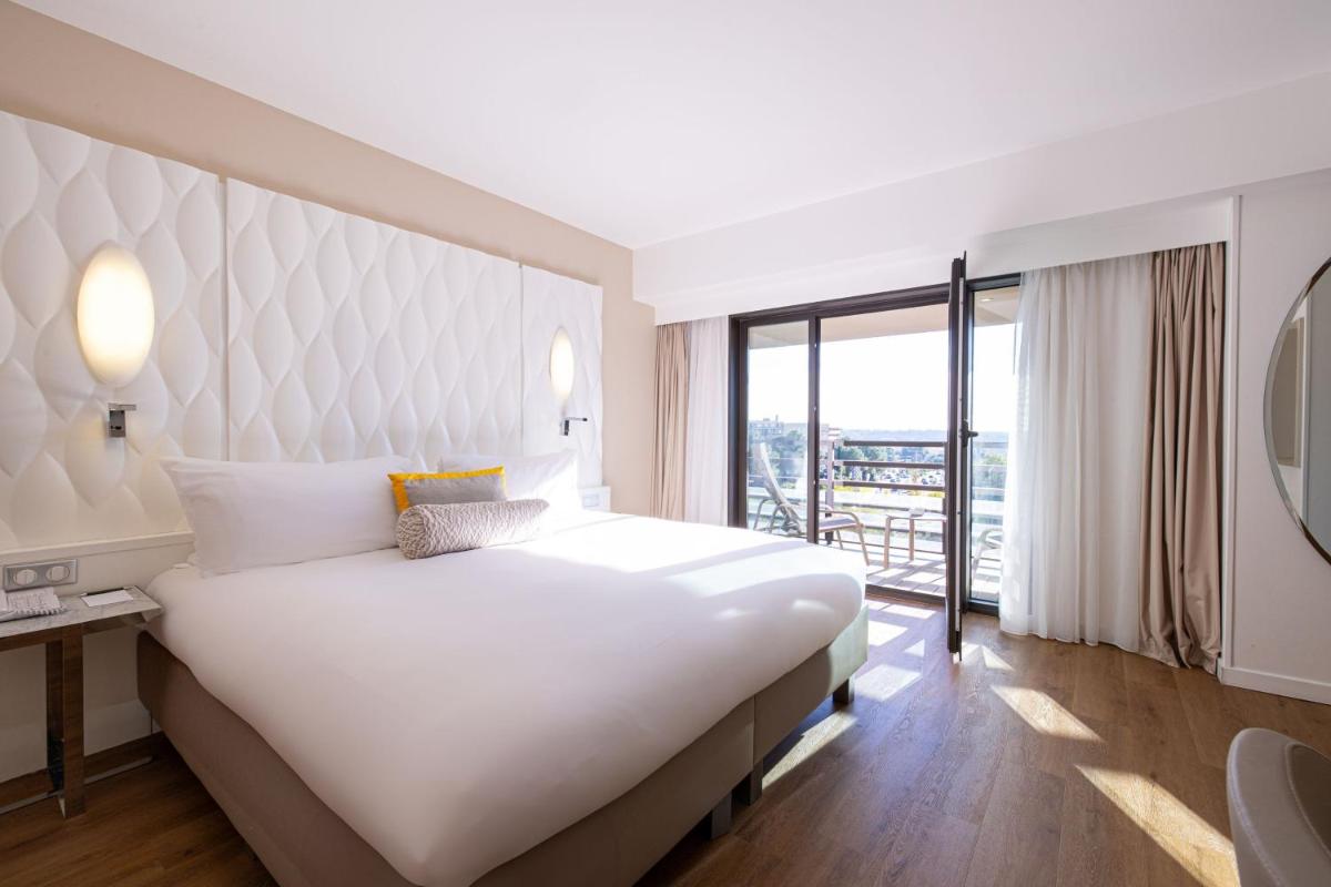 Un ou plusieurs lits dans un hébergement de l'établissement Renaissance Aix-en-Provence Hotel