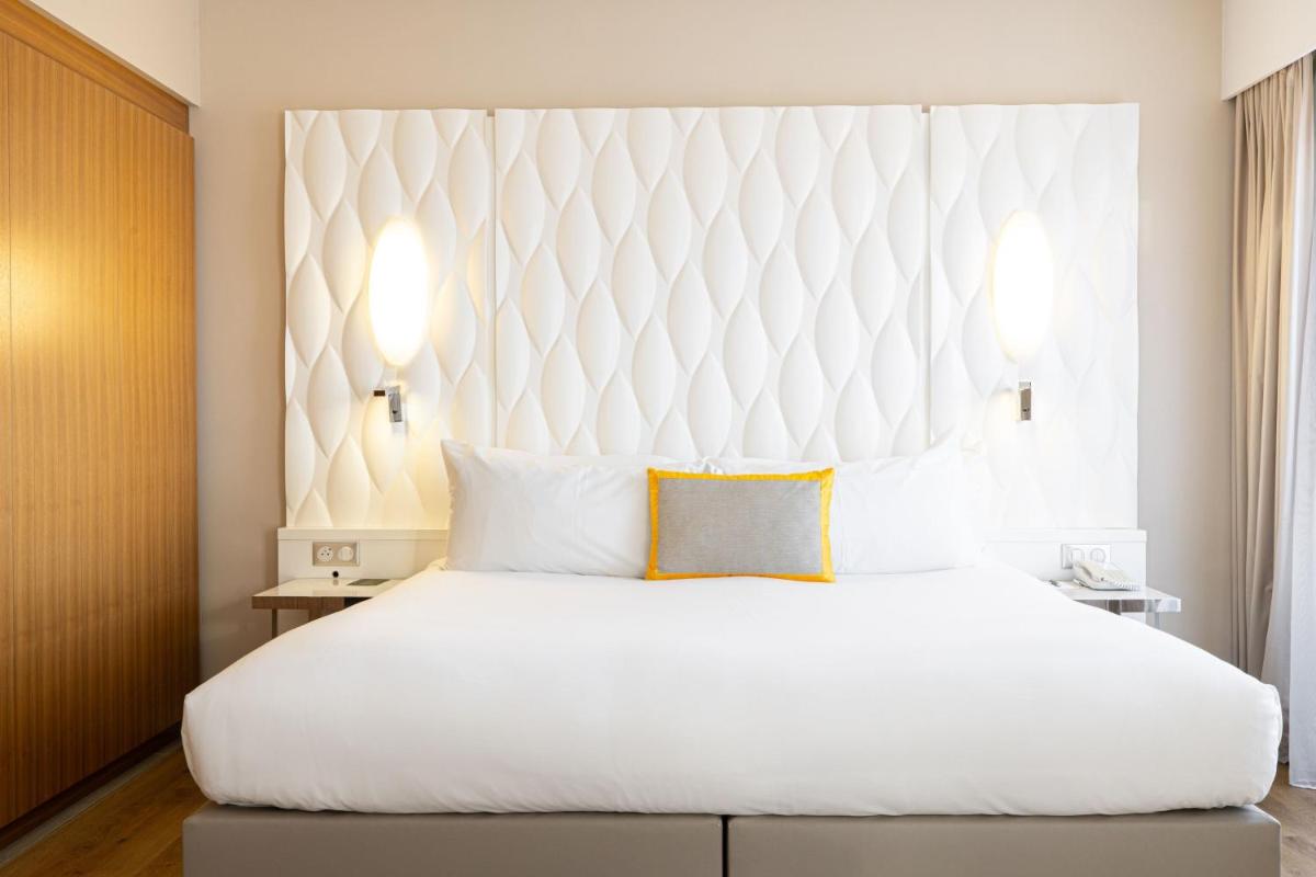 Un ou plusieurs lits dans un hébergement de l'établissement Renaissance Aix-en-Provence Hotel