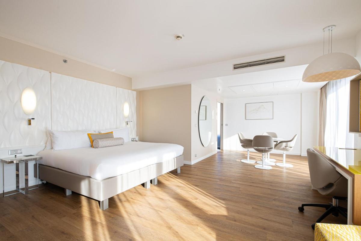 Un ou plusieurs lits dans un hébergement de l'établissement Renaissance Aix-en-Provence Hotel