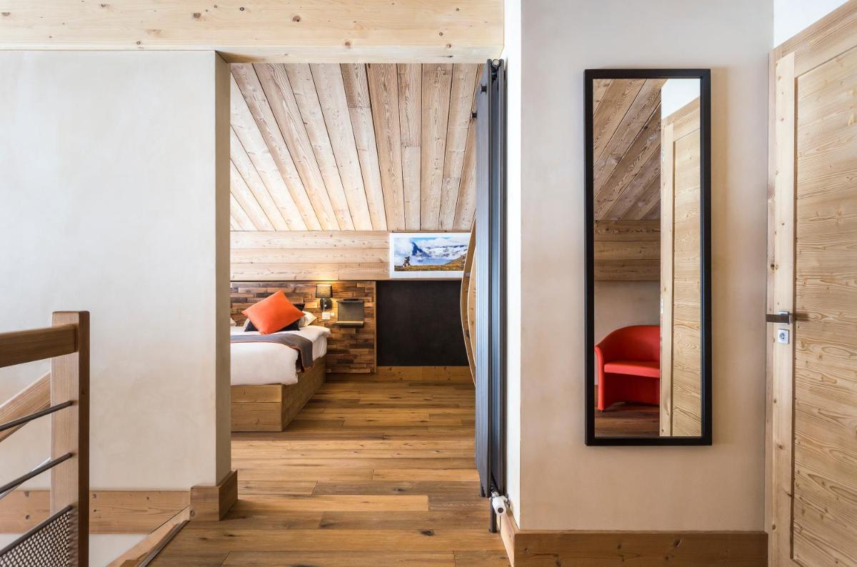 Un ou plusieurs lits dans un hébergement de l'établissement Hôtel Saint Charles Val Cenis
