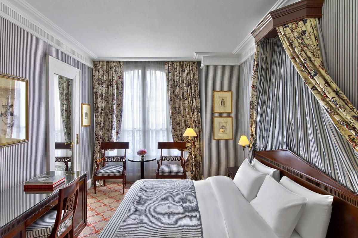 Un ou plusieurs lits dans un hébergement de l'établissement Le Dokhan's Paris Arc de Triomphe, a Tribute Portfolio Hotel
