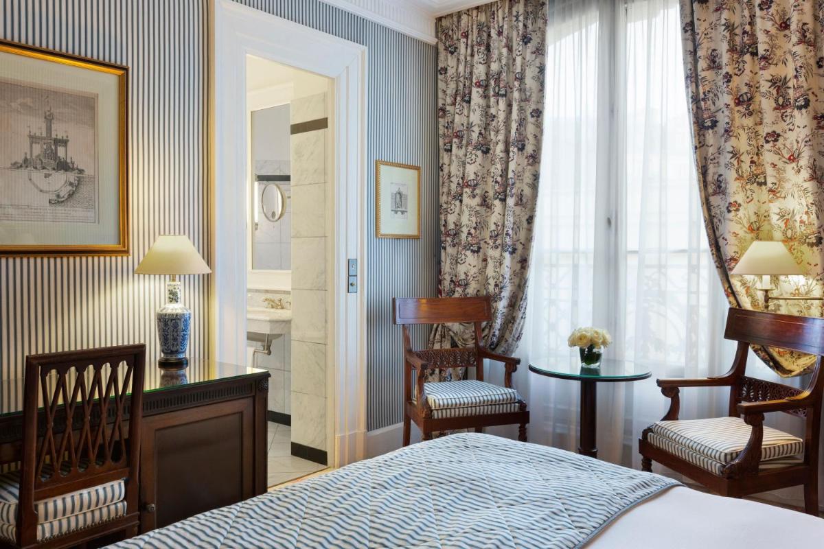 Un ou plusieurs lits dans un hébergement de l'établissement Le Dokhan's Paris Arc de Triomphe, a Tribute Portfolio Hotel