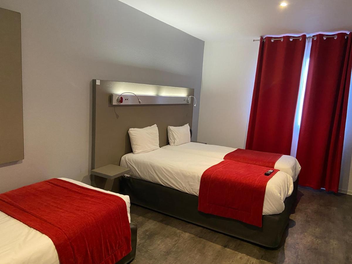 Un ou plusieurs lits dans un hébergement de l'établissement The Originals City, Hôtel Les Dômes, Perpignan Sud Saleilles