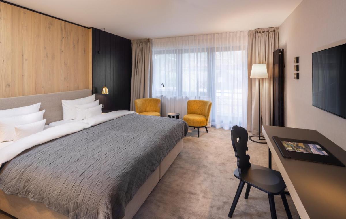 Ein Bett oder Betten in einem Zimmer der Unterkunft Wellness & Genuss Resort - Engel Obertal