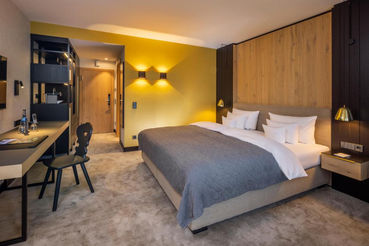Ein Bett oder Betten in einem Zimmer der Unterkunft Wellness & Genuss Resort - Engel Obertal