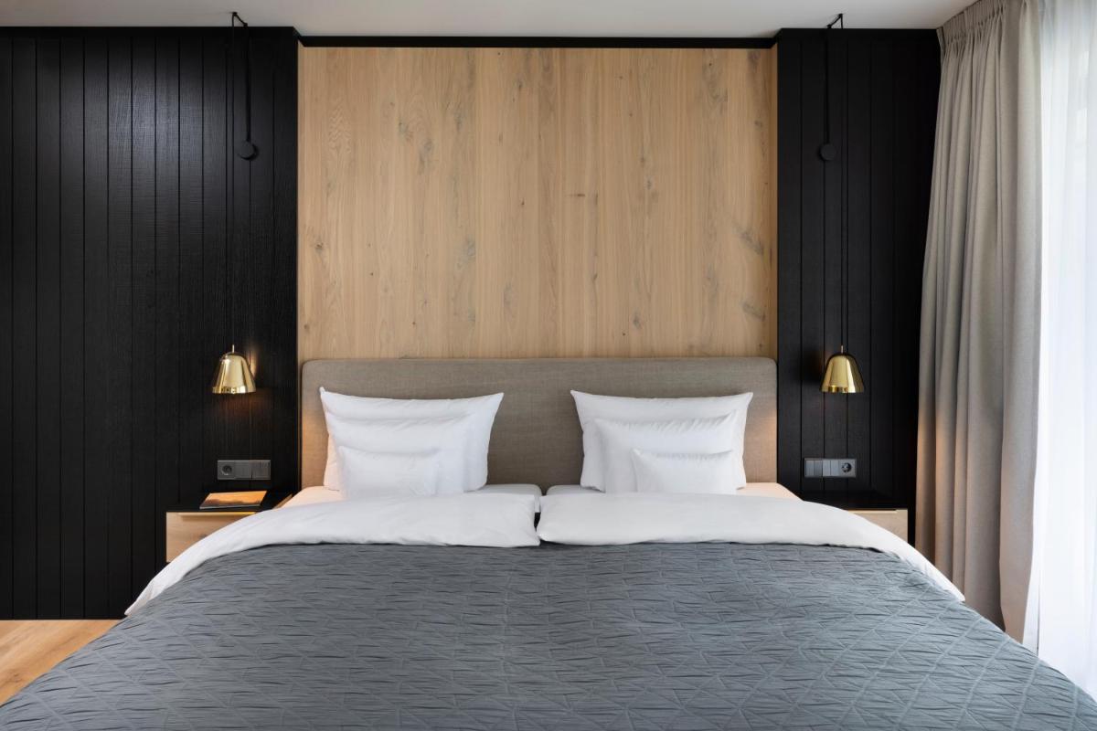 Ein Bett oder Betten in einem Zimmer der Unterkunft Wellness & Genuss Resort - Engel Obertal