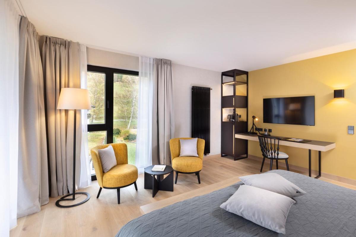 Ein Bett oder Betten in einem Zimmer der Unterkunft Wellness & Genuss Resort - Engel Obertal