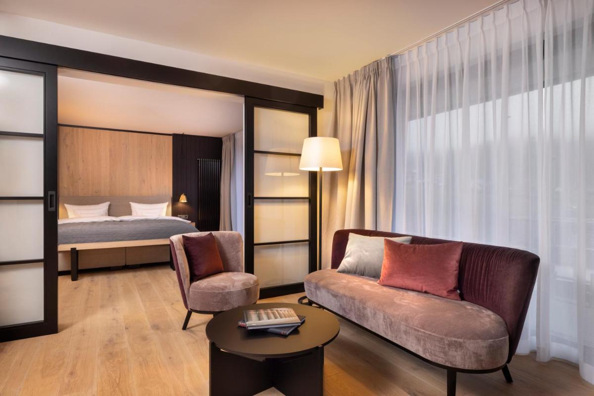 Ein Bett oder Betten in einem Zimmer der Unterkunft Wellness & Genuss Resort - Engel Obertal