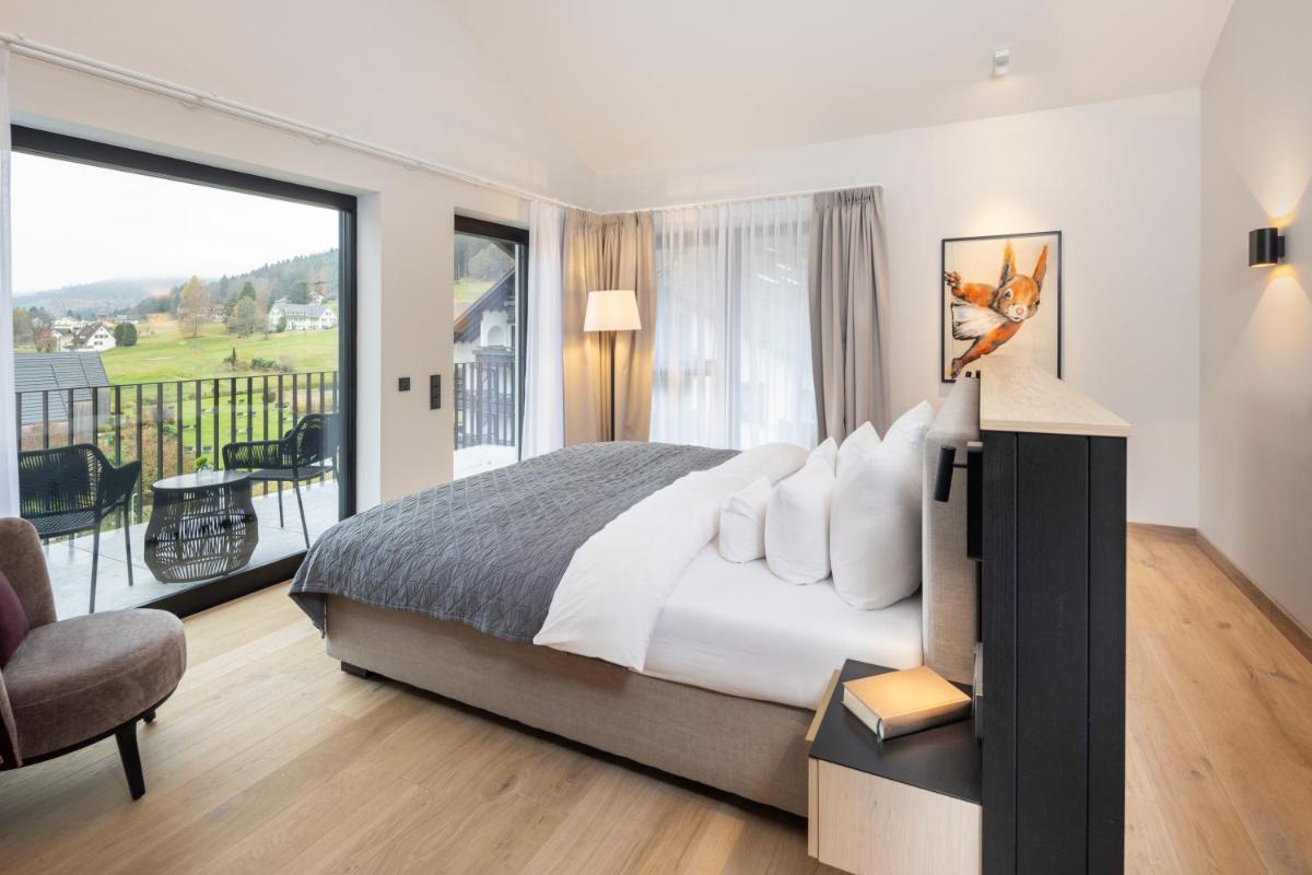 Ein Bett oder Betten in einem Zimmer der Unterkunft Wellness & Genuss Resort - Engel Obertal
