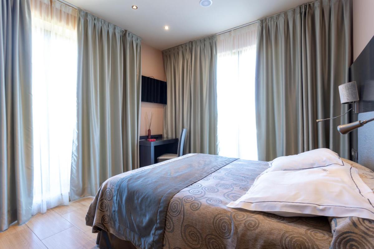 Cama o camas de una habitación en Hotel Felisa SPA