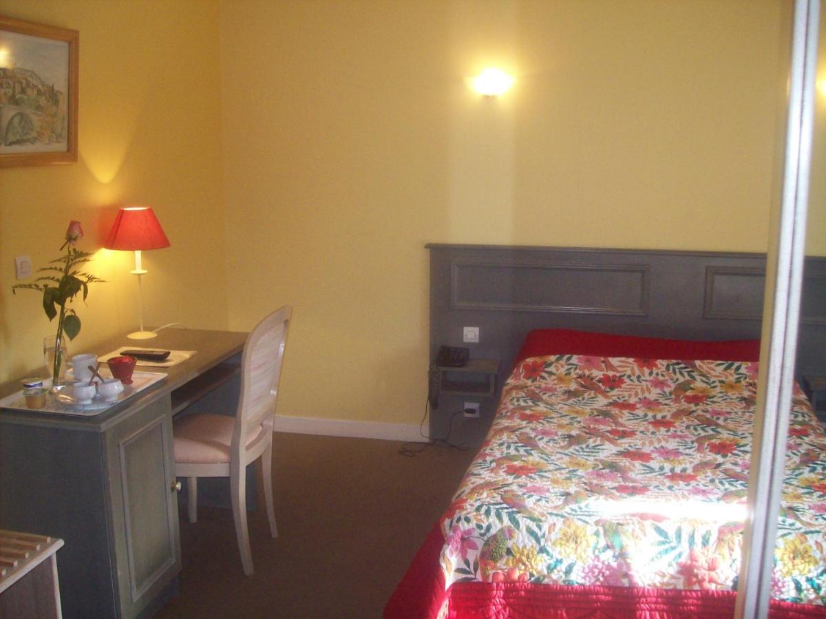 Un ou plusieurs lits dans un hébergement de l'établissement Maison Legate "Hôtel Le Baudiere & Spa"