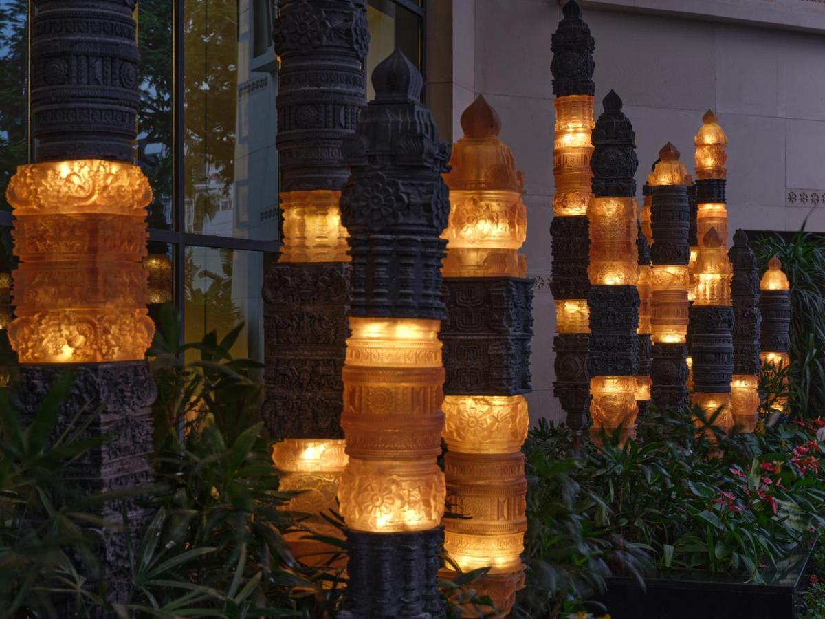 a display of lights in a garden at night at The Leela Hyderabad Banjara Hills in Hyderabad