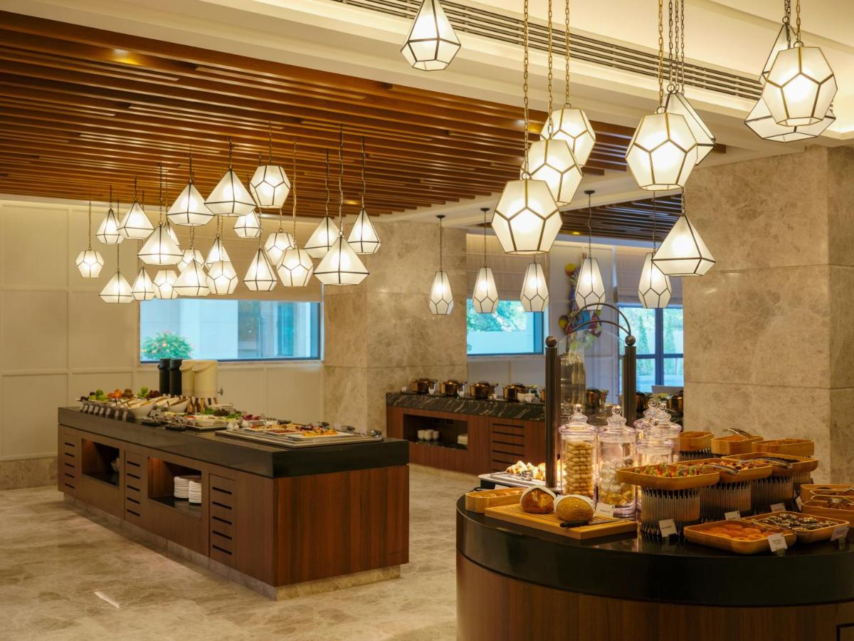 a large room with aasteryasteryasteryasteryasteryasteryasteryasteryasteryasteryastery at The Leela Hyderabad Banjara Hills in Hyderabad