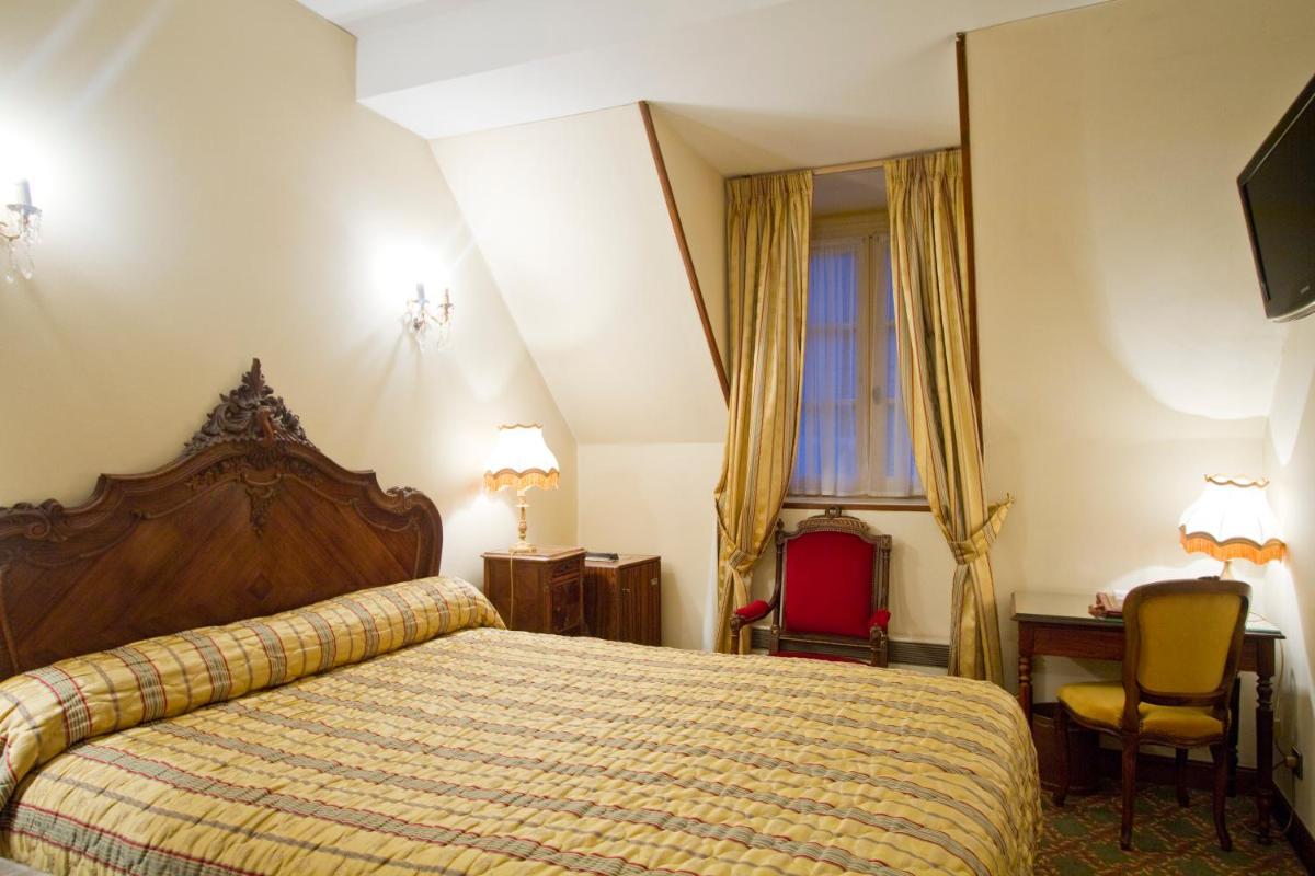Un ou plusieurs lits dans un hébergement de l'établissement Hôtel Le Cep & Spa
