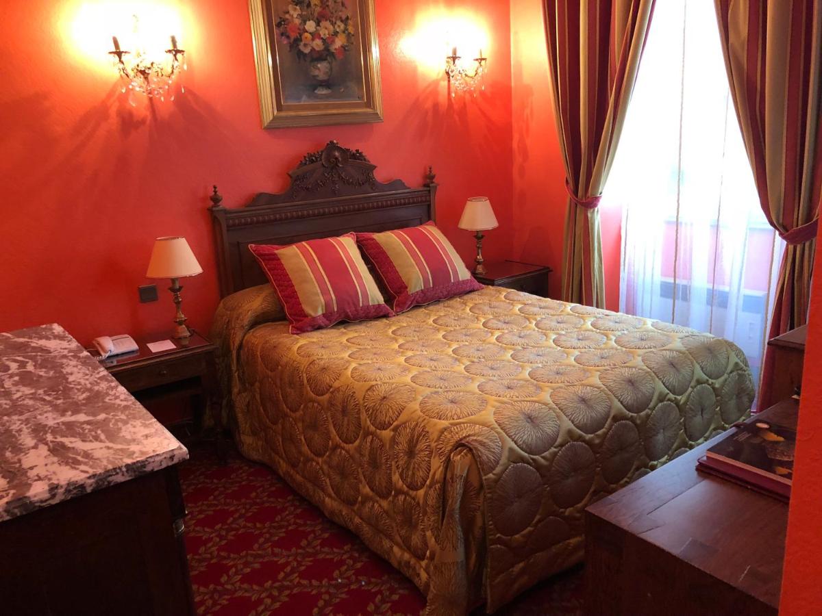 Un ou plusieurs lits dans un hébergement de l'établissement Hôtel Le Cep & Spa