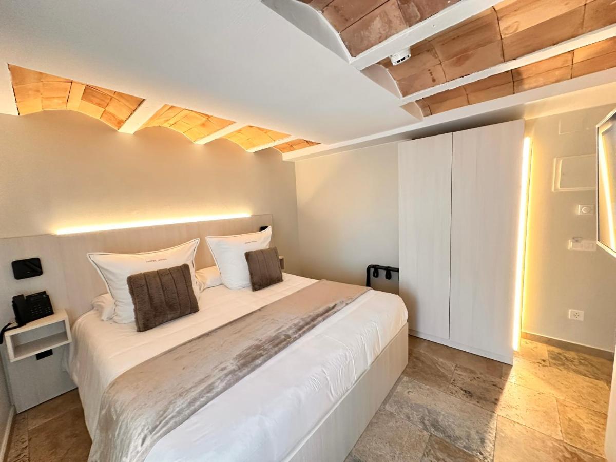 Cama o camas de una habitación en Boutique Hotel Comtal Empuries
