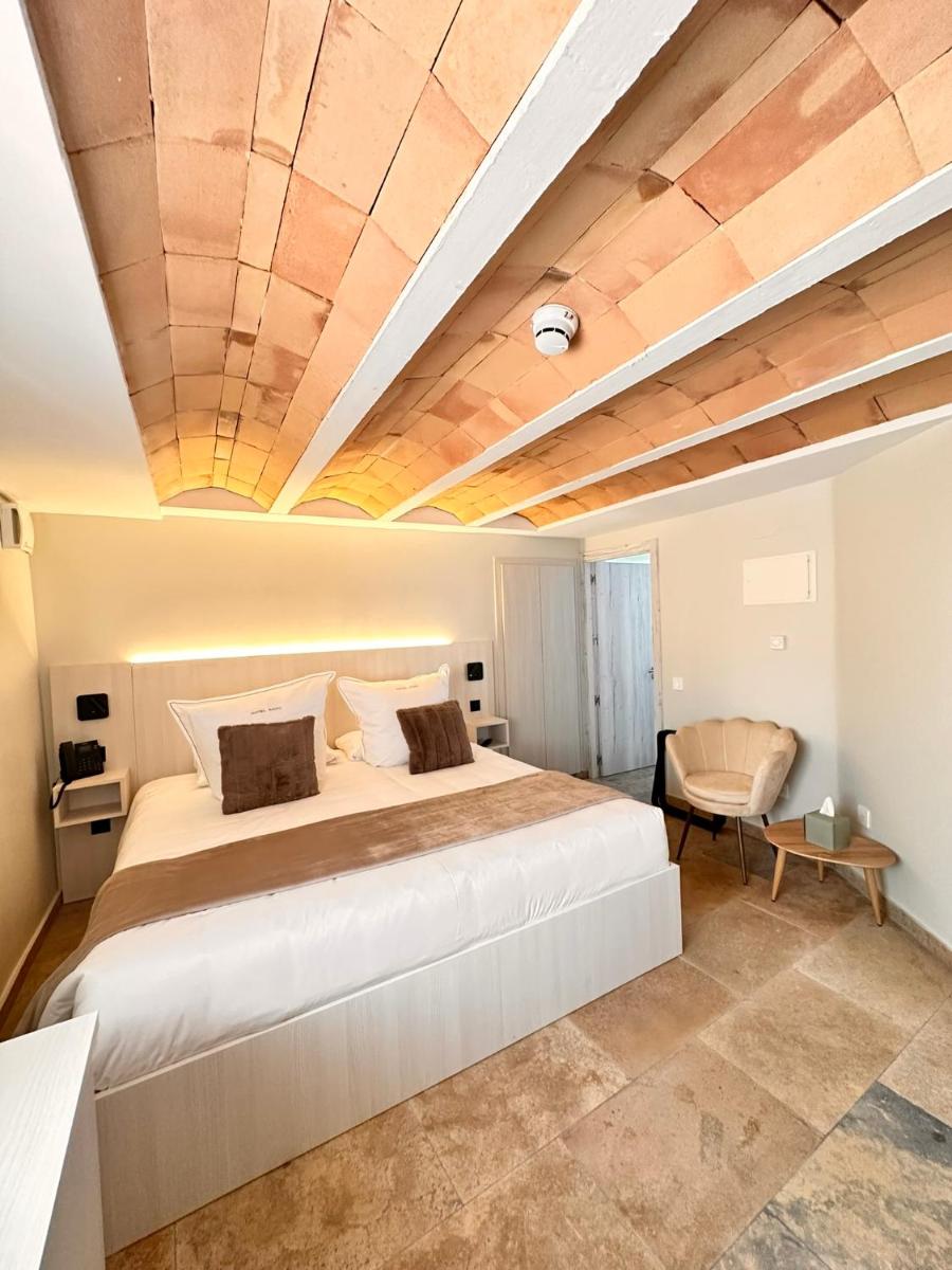 Cama o camas de una habitación en Boutique Hotel Comtal Empuries