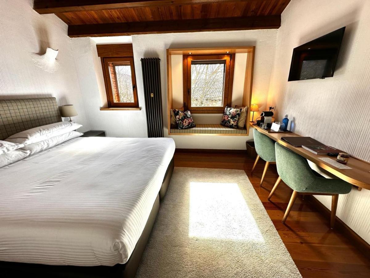 Cama o camas de una habitación en Molino de Alcuneza Relais & Châteaux