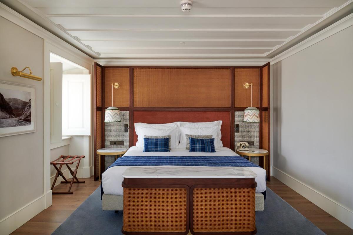 Uma cama ou camas num quarto em Palácio Ludovice Wine Experience Hotel
