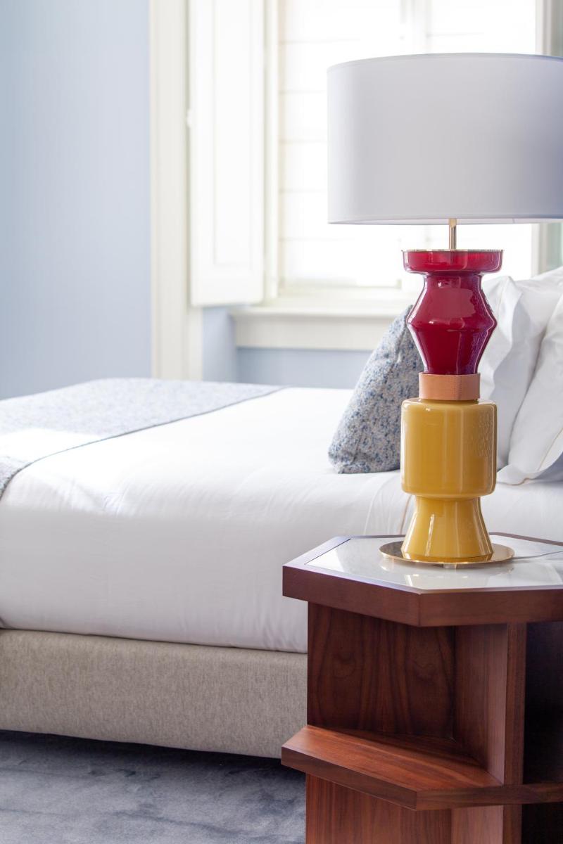 Uma cama ou camas num quarto em Palácio Ludovice Wine Experience Hotel