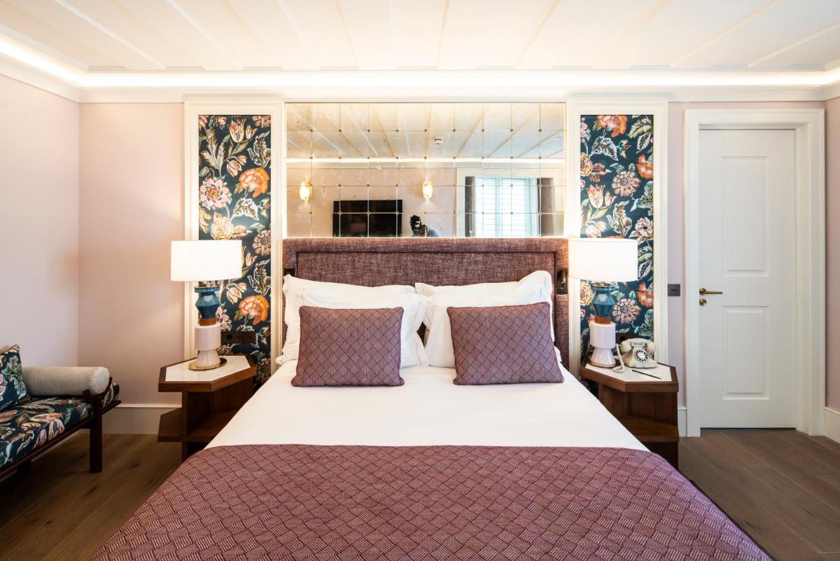 Uma cama ou camas num quarto em Palácio Ludovice Wine Experience Hotel
