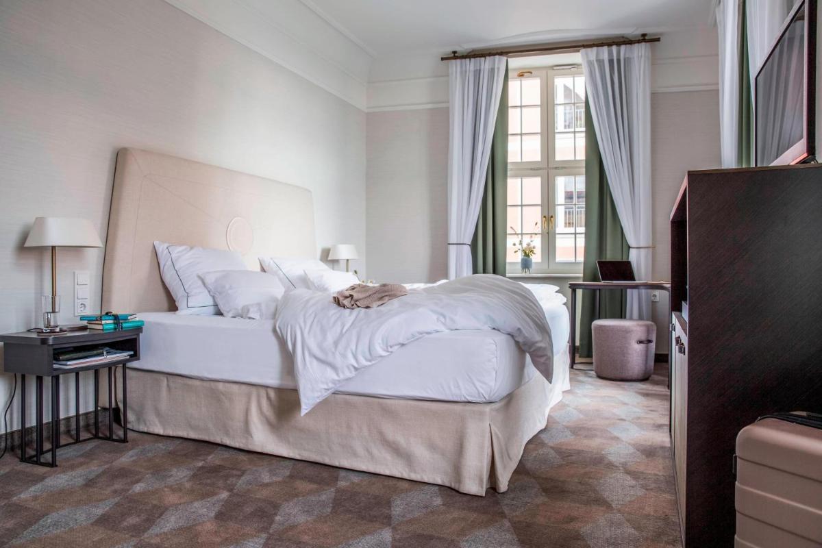 Ein Bett oder Betten in einem Zimmer der Unterkunft Gewandhaus Dresden, Autograph Collection