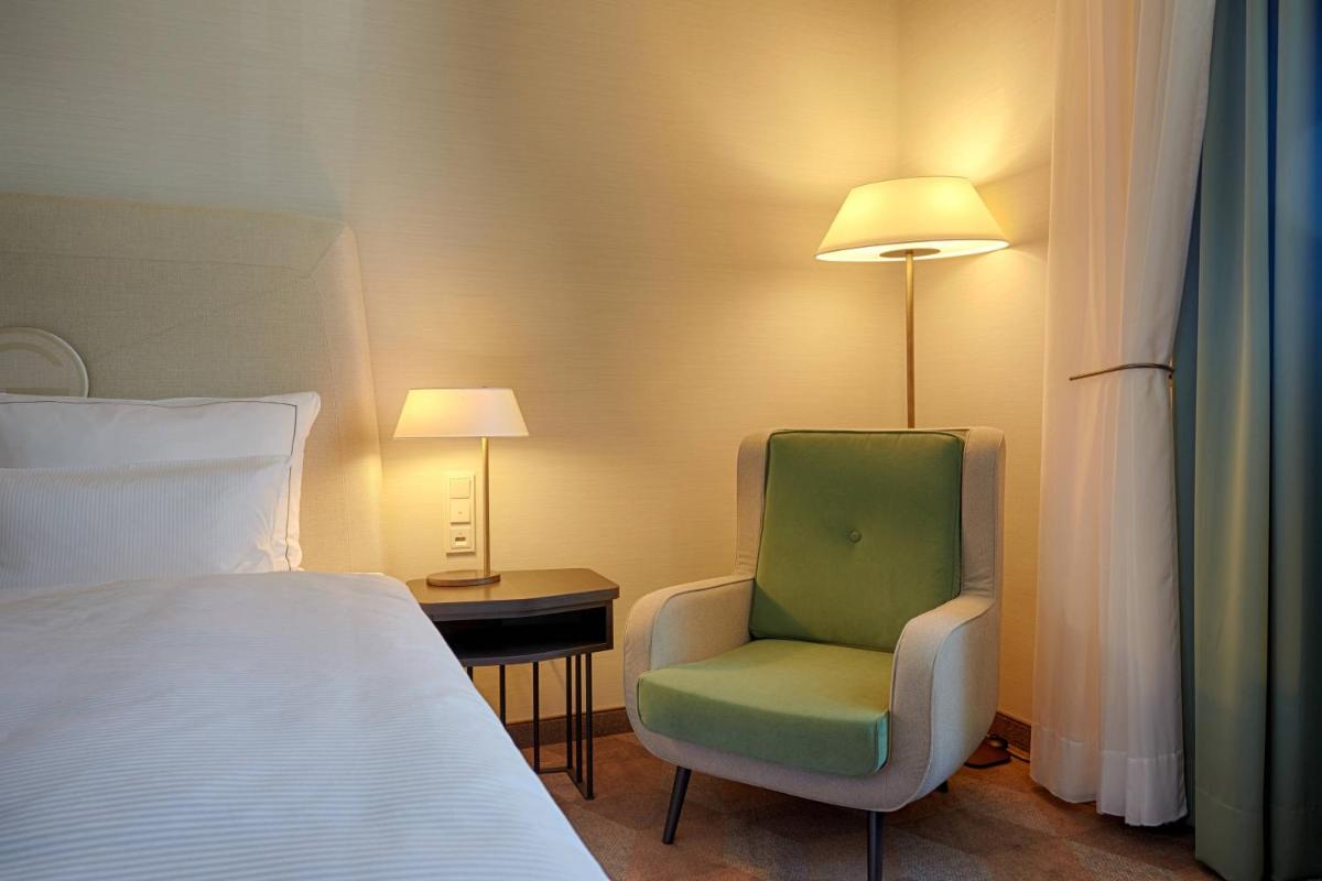 Ein Bett oder Betten in einem Zimmer der Unterkunft Gewandhaus Dresden, Autograph Collection