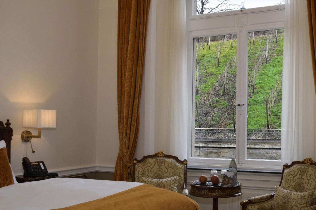 Ein Bett oder Betten in einem Zimmer der Unterkunft Schloss Lieser, Autograph Collection