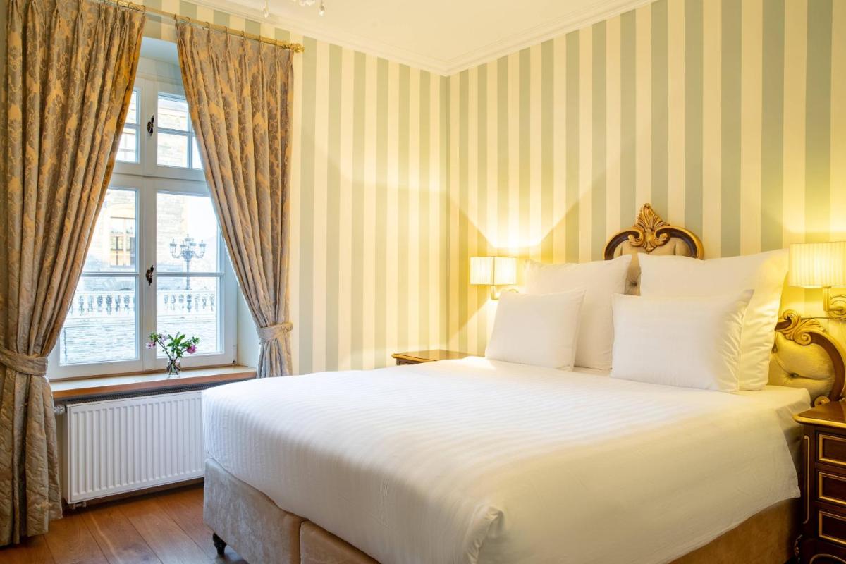 Ein Bett oder Betten in einem Zimmer der Unterkunft Schloss Lieser, Autograph Collection