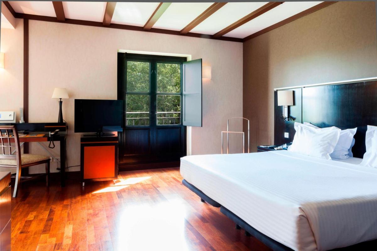 Cama o camas de una habitación en AC Hotel Palacio de Santa Ana by Marriott