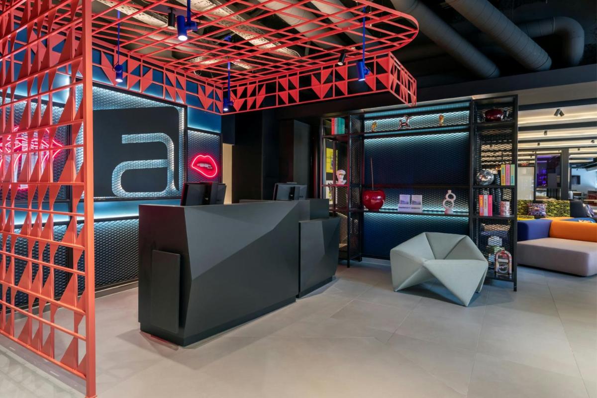 Coin salon dans l'établissement Aloft Dijon
