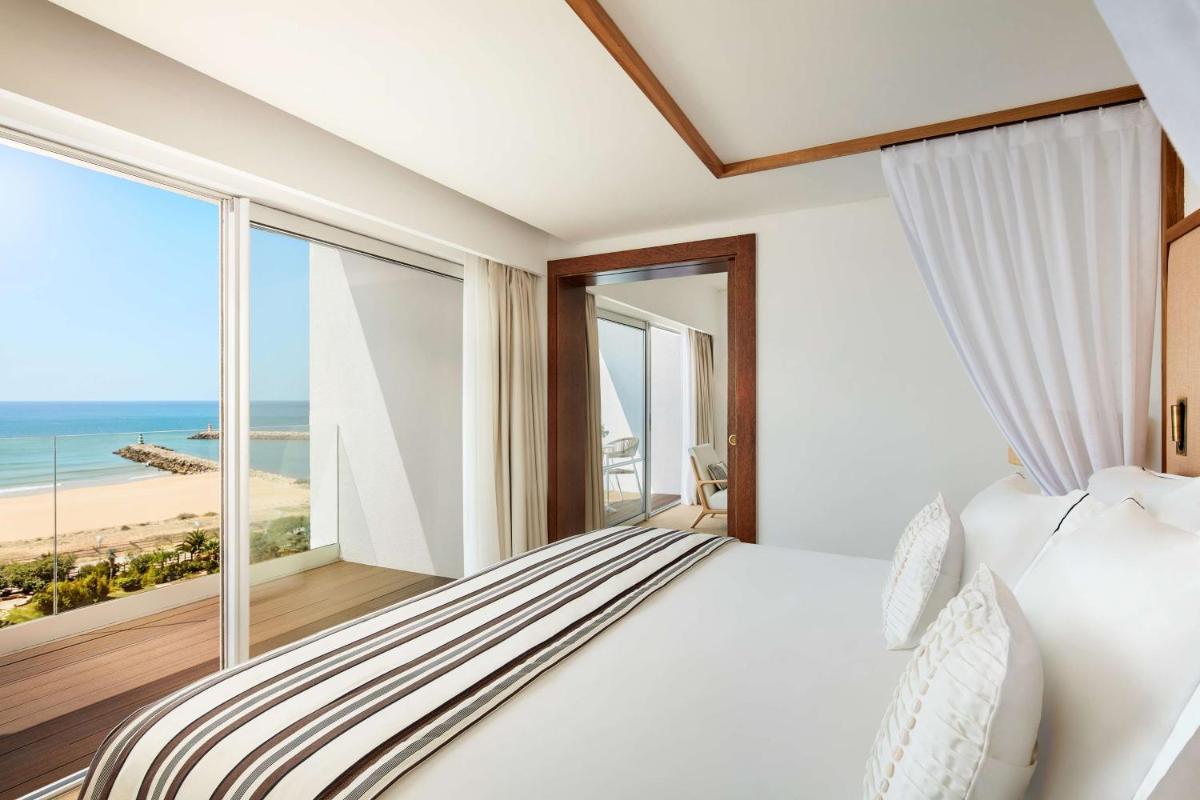 Uma cama ou camas num quarto em Tivoli Marina Vilamoura