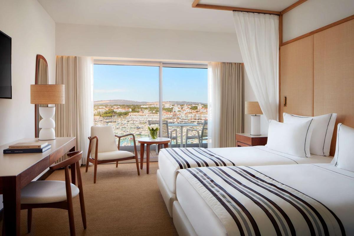 Uma cama ou camas num quarto em Tivoli Marina Vilamoura