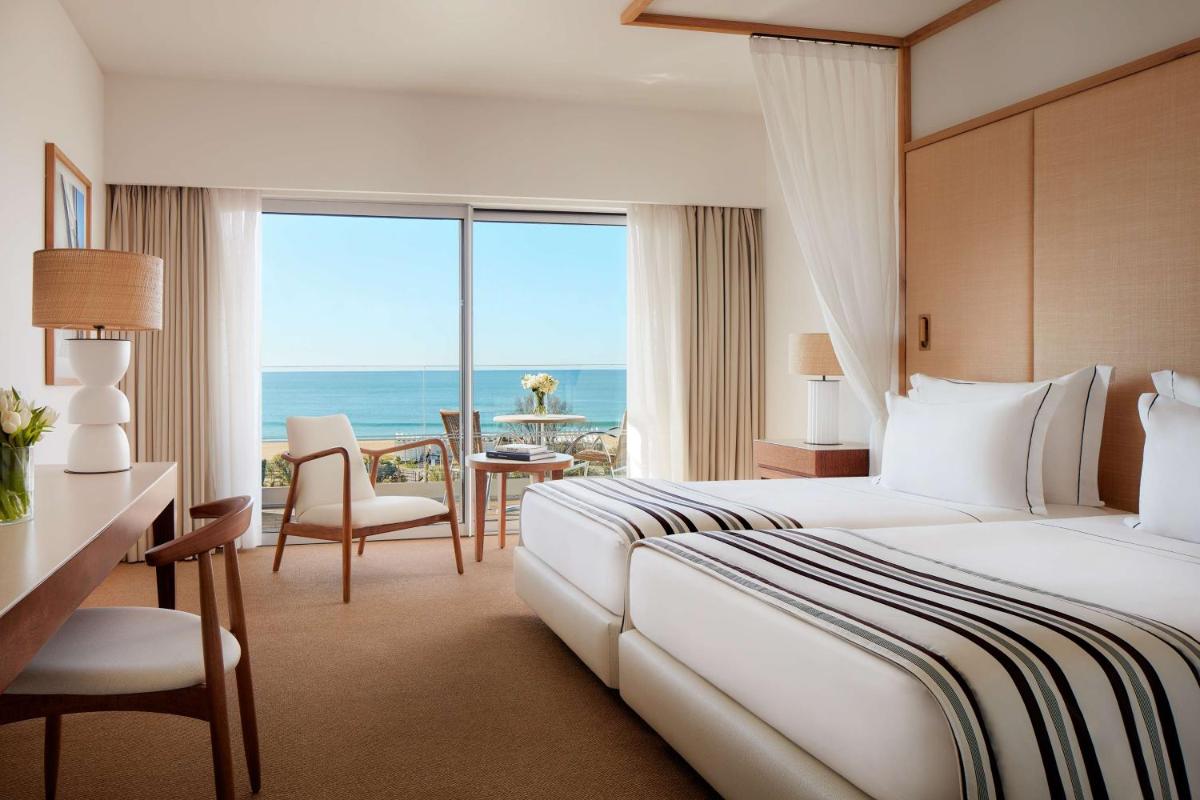 Uma cama ou camas num quarto em Tivoli Marina Vilamoura