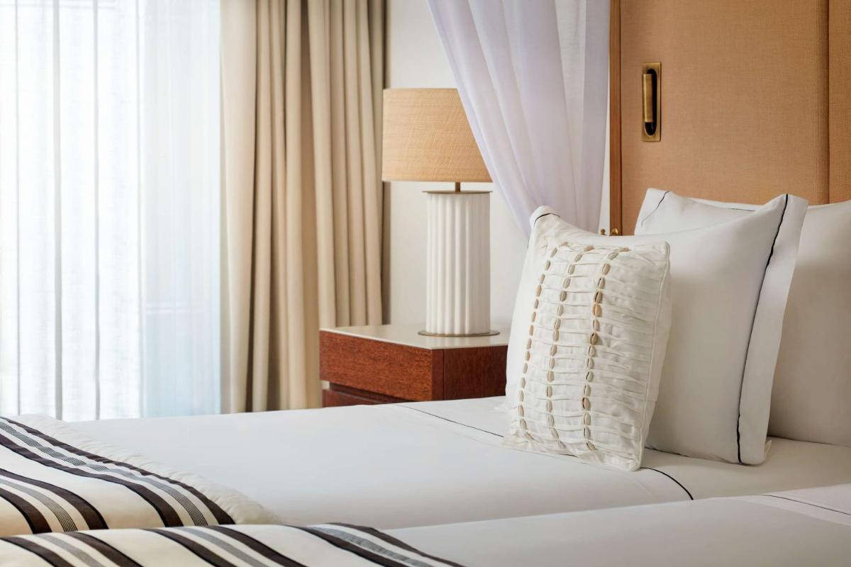 Uma cama ou camas num quarto em Tivoli Marina Vilamoura