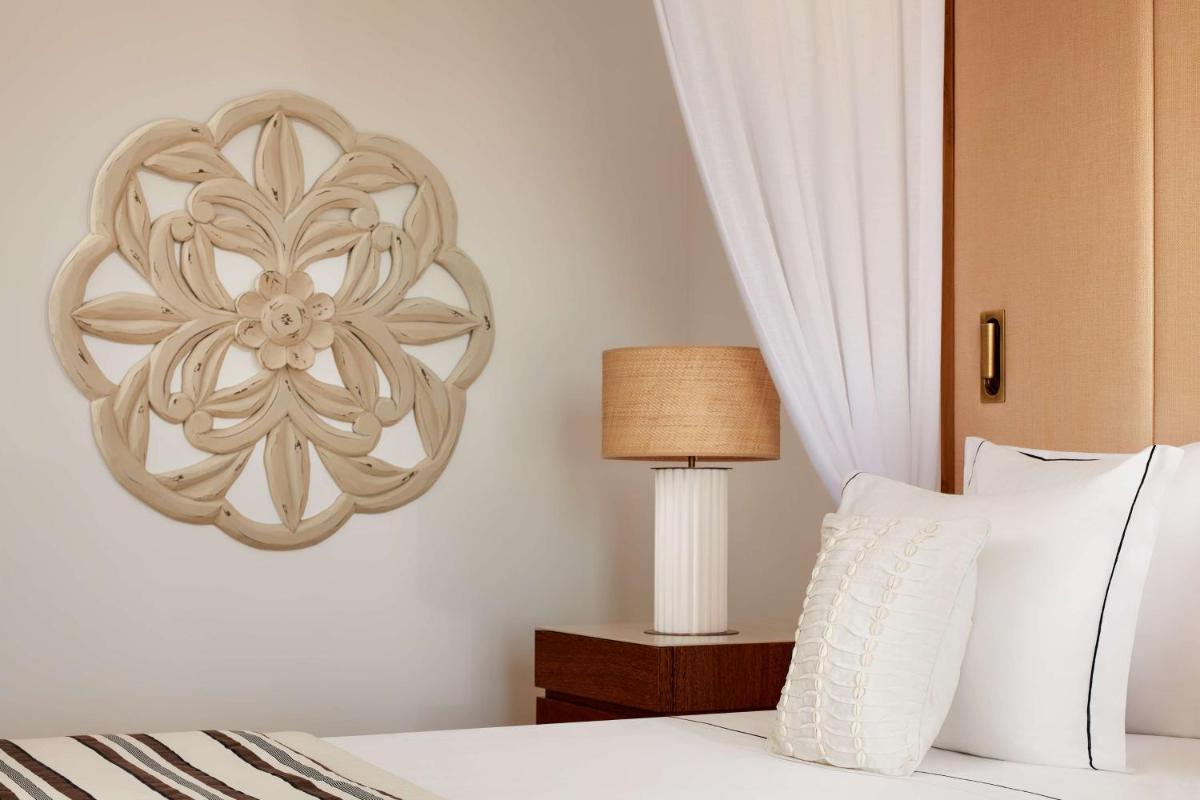 Uma cama ou camas num quarto em Tivoli Marina Vilamoura