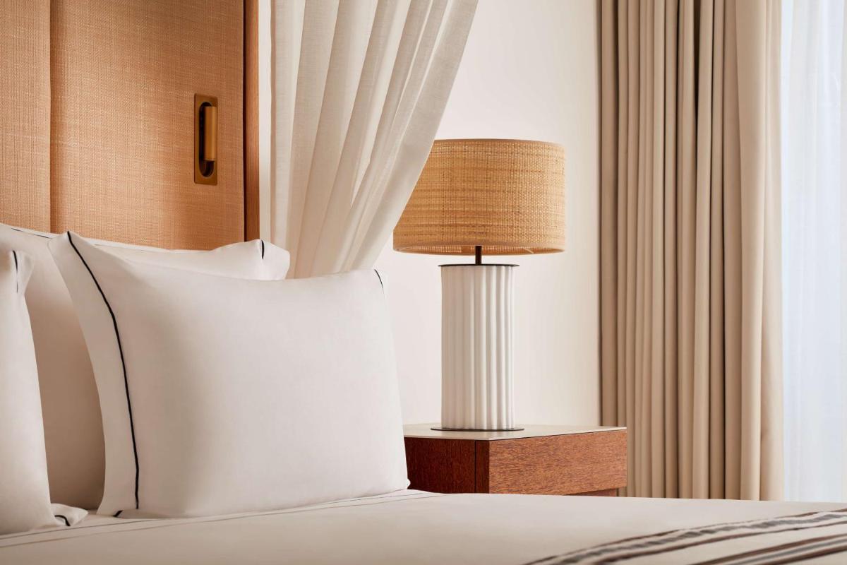 Uma cama ou camas num quarto em Tivoli Marina Vilamoura