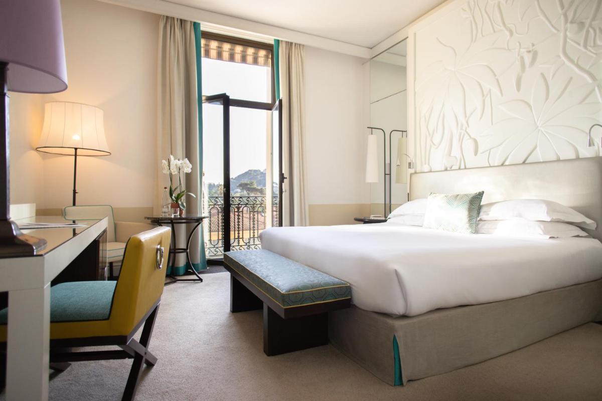 Un ou plusieurs lits dans un hébergement de l'établissement Hotel Royal-Riviera