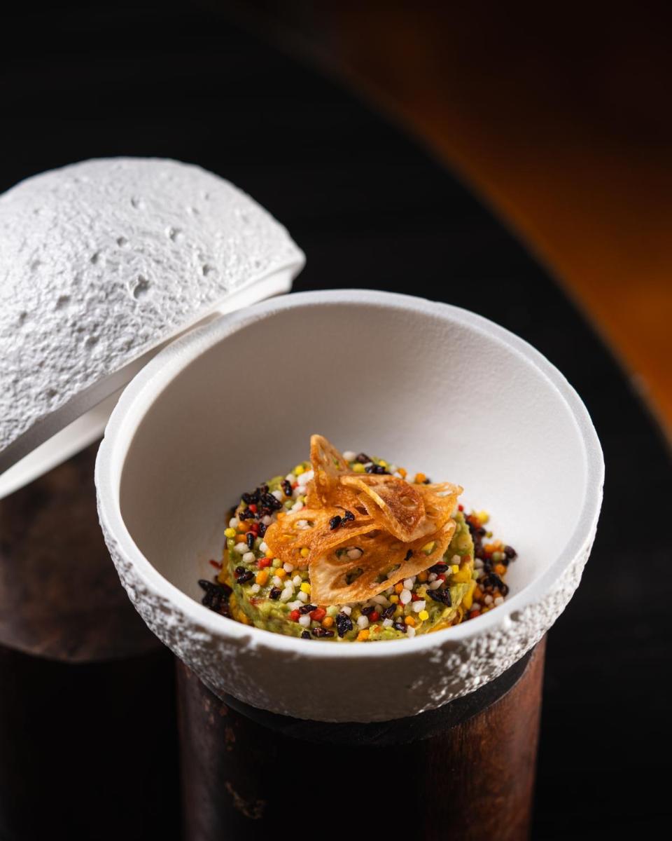 a white bowl filled with food on a table at JW Marriott Hotel Kolkata in Kolkata